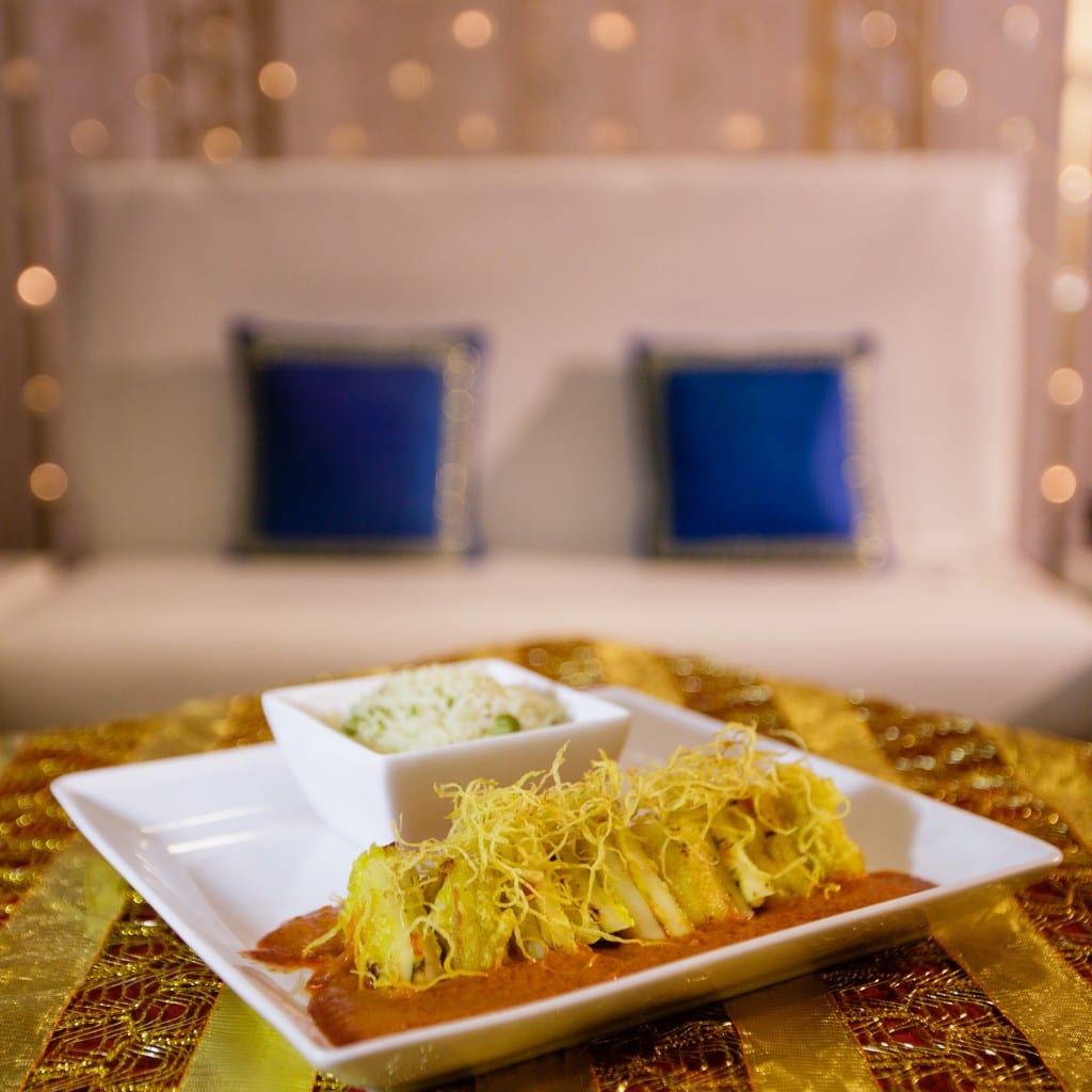 A plated Indian fusion course at an IndAroma wedding reception.