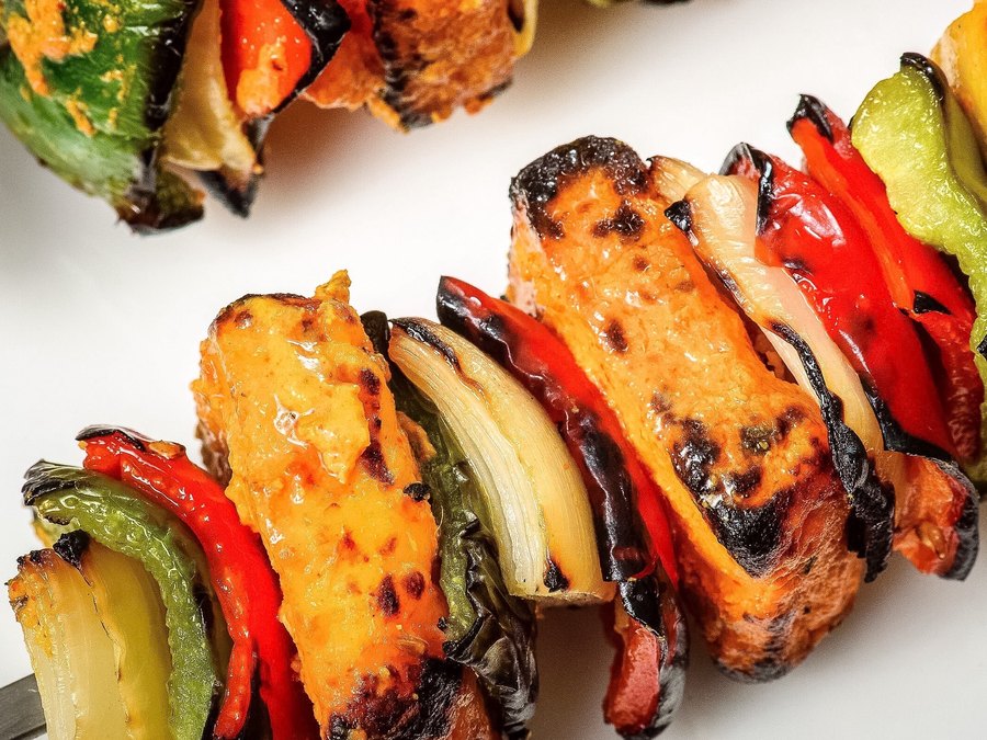 Paneer shashlik skewers — charred paneer layered with peppers and onion, straight off the tandoor.
